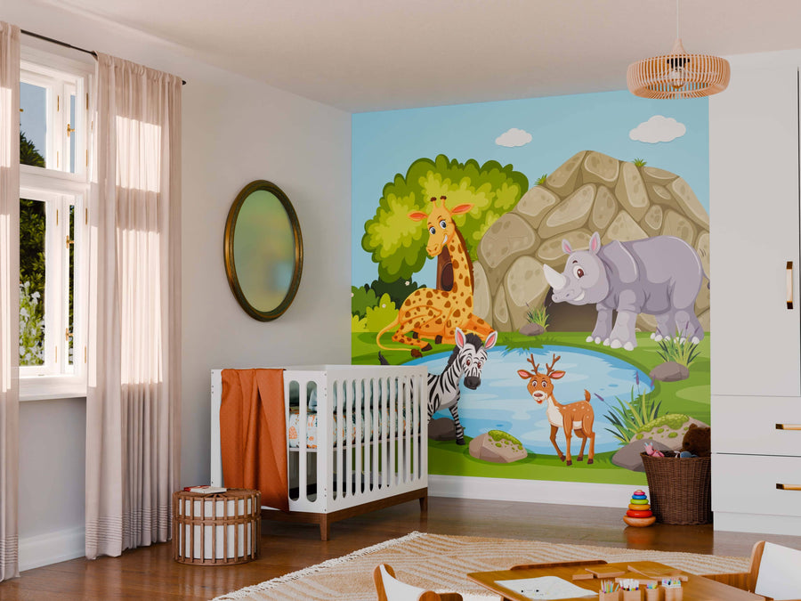 A nursery features a white crib, orange blanket, wicker stool, and the Lush Safari Scene Wall Mural with cartoon giraffe, zebra, deer, and rhino by a pond. Light filters through sheer curtains and a round mirror decorates the wall.