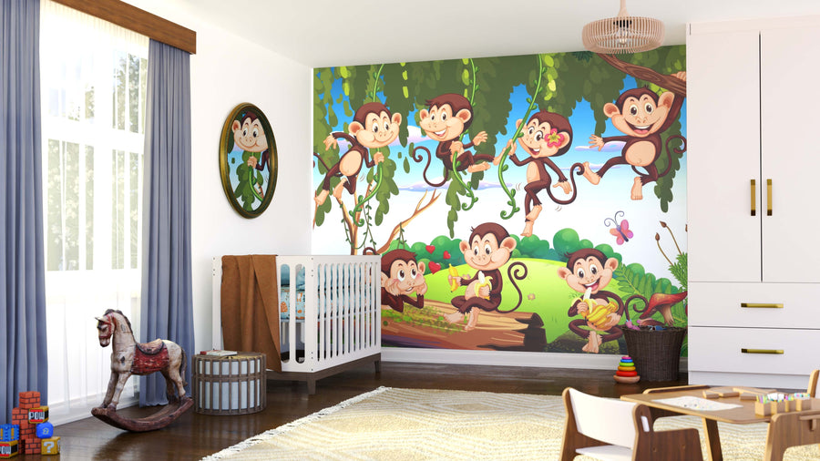 A nursery with a crib, rocking horse, toys, and the Monkeys Swinging Wall Mural—six cartoon monkeys swinging on vines in a sunny jungle. Light streams in through a window with blue curtains, and playful peel and stick decor adds colorful charm.