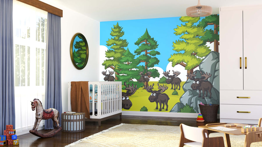 A bright, modern nursery with a crib, rocking horse, and toys features the Moose in the Pines Wall Mural—cartoon moose and pine trees under a blue sky—for a lively woodland theme in the cozy, sunlit room.