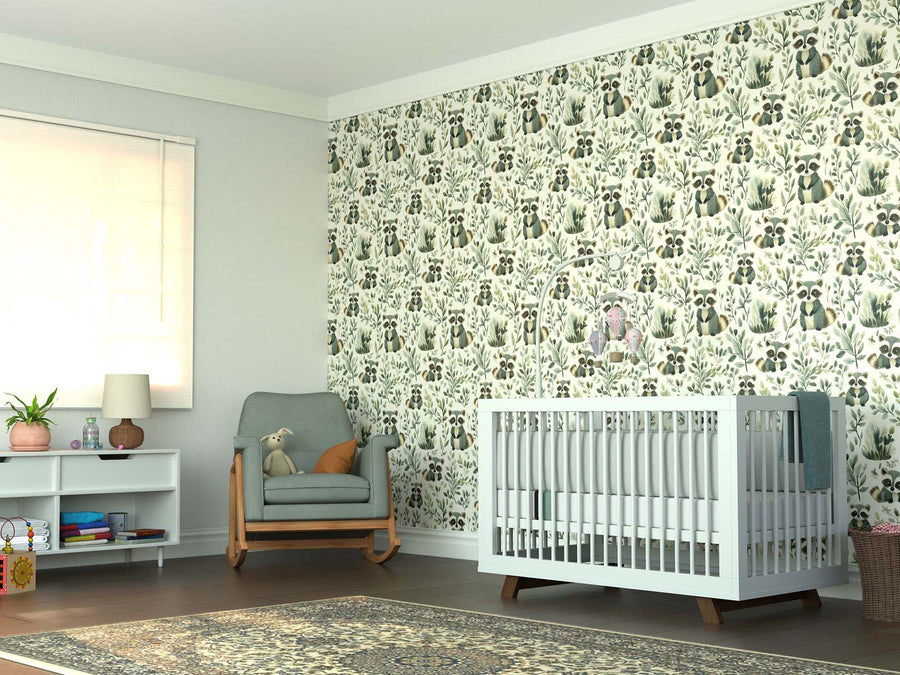 Bright nursery with a white crib, green rocking chair holding a teddy bear, toy shelf with lamp, large rug on wooden floor, and sunlight streaming in. The wall features the Playful Raccoons Wall Mural with fun animal and plant designs.