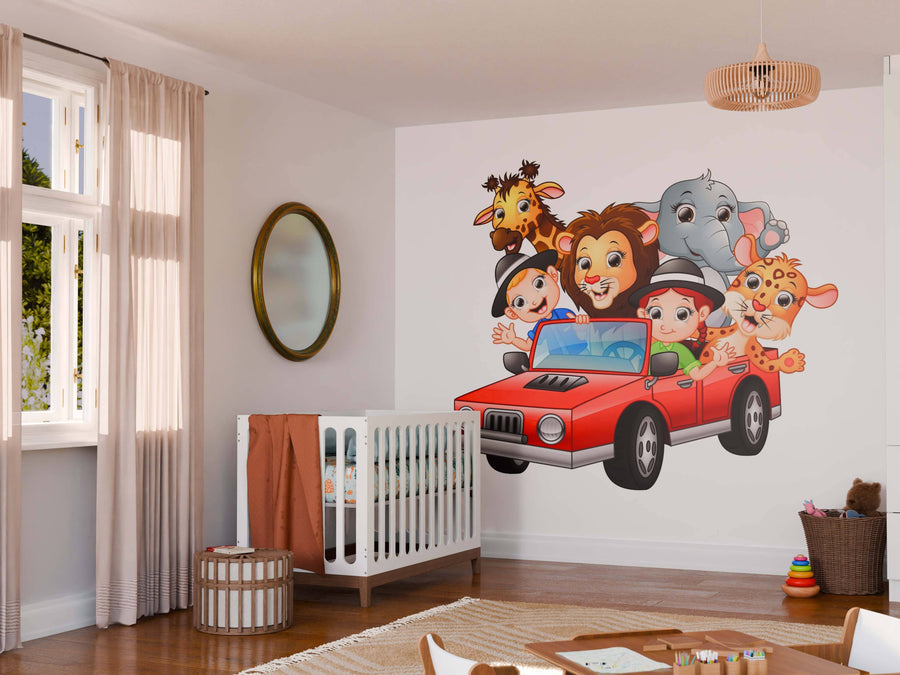 A bright nursery features a crib, round mirror, and the Safari Adventure Ride Wall Mural—a custom print showing two smiling children driving a red car with cartoon animals. Sunlight streams in, making the space cheerful and inviting.