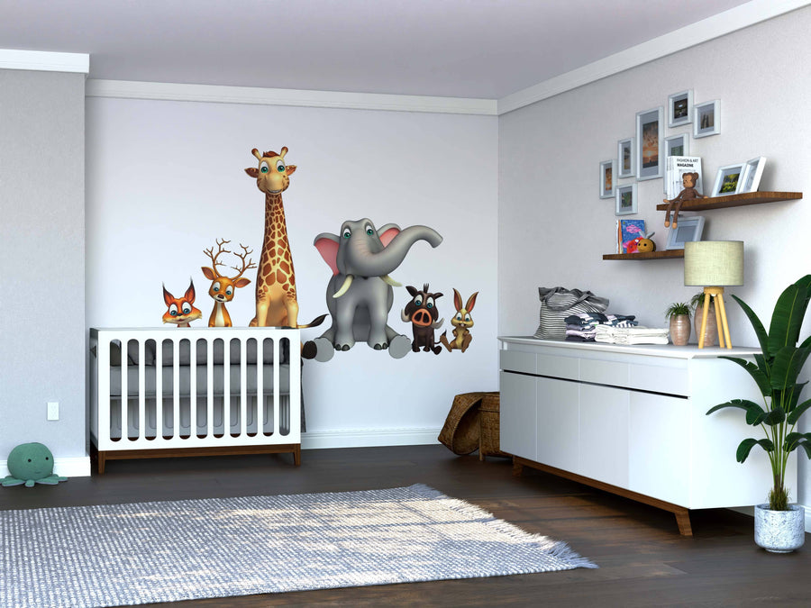 A modern nursery with a white crib, dresser, and plant. The wall features cartoon animal decals and the Safari Crew Wall Mural showing a fox, deer, giraffe, elephant, zebra, and monkey. Floating shelves display photos and stuffed animals above the wood floor.