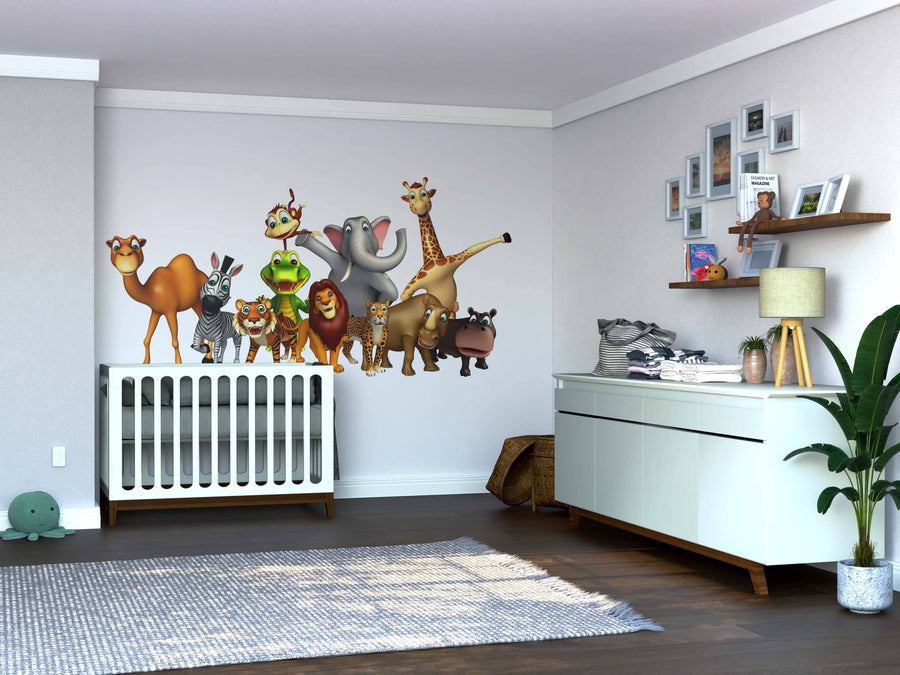 A nursery features a crib, dresser, plant, and the Smiling Animal Crew Wall Mural for playful charm. Removable wallpaper showcases cartoon jungle animals. Shelves display photos and baby items, while a woven basket sits on the floor.
