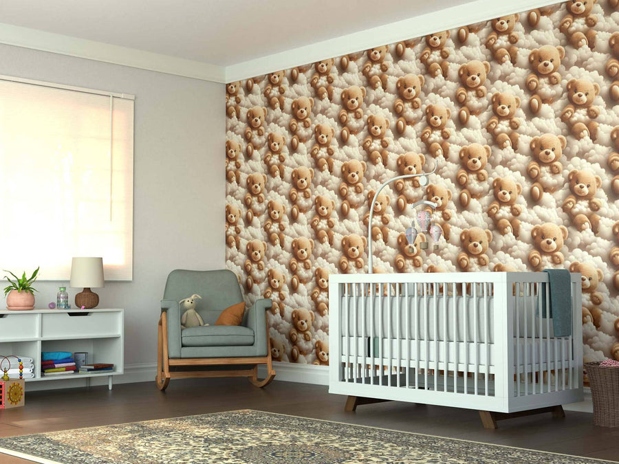 A cozy nursery with a white crib, green armchair, shelf, and lamp features the Snuggly Bears Wall Mural—a removable teddy bear cloud design—on the back wall, adding a soft, playful vibe as sunlight streams through the window.