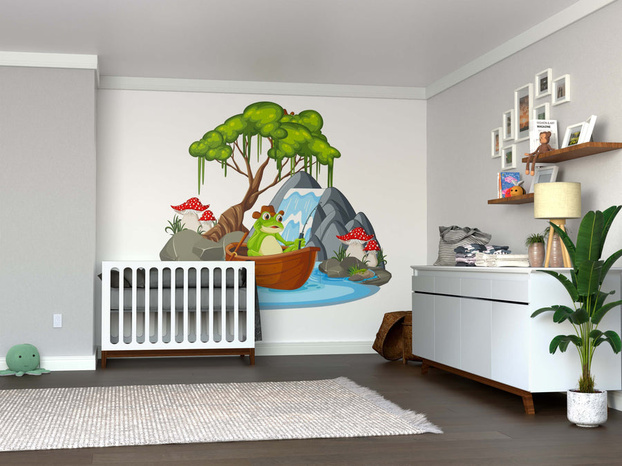 A nursery with gray walls, a white crib and dresser, a plant, plush turtle toy, woven baskets, and the Tranquil Pond Escape Wall Mural featuring a cartoon frog in a boat on a pond adds playful charm to the space.