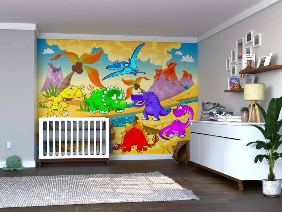A nursery with a crib and changing table features the Volcano Valley Dinosaurs Wall Mural, displaying cartoon dinosaurs, volcanoes, trees, and mountains. The room also includes a plant, shelves, and baby supplies.