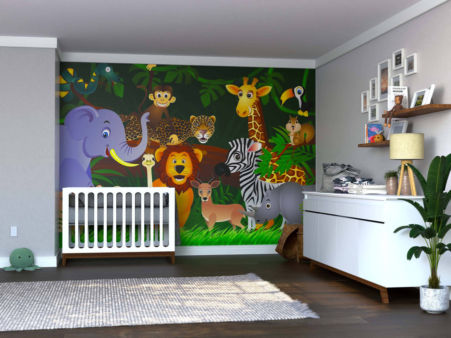 A nursery featuring the Wild Cartoon Animals Wall Mural, a jungle-themed peel-and-stick design with elephants, lions, monkeys, giraffes, and zebras. A white crib, dresser with changing pad, plush toys, plant, and framed art add coziness.