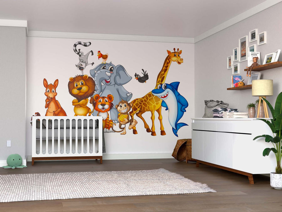 A bright nursery with a white crib, modern furniture, and the Wild Companions Wall Mural featuring cheerful cartoon animals—kangaroo, lion, elephant, giraffe, tiger, and blue shark—all smiling together.
