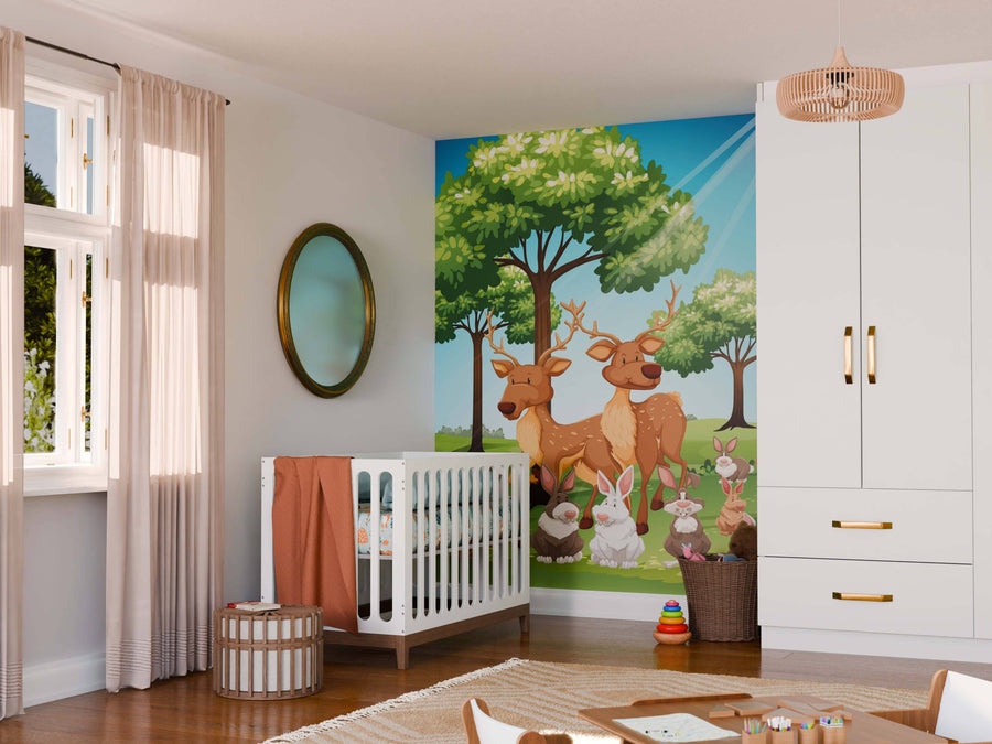 A bright nursery features a crib, round mirror, changing table, and the Woodland Friends Wall Mural with cartoon deer, rabbits, and trees under a blue sky. Sunlight shines through sheer curtains onto neatly arranged toys and baskets.