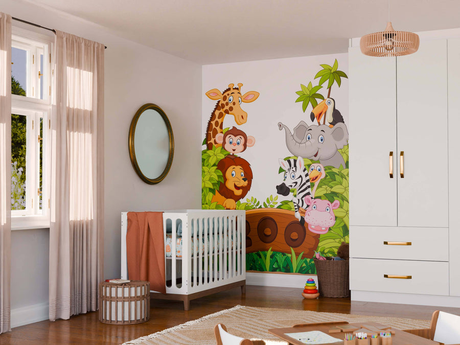 A bright nursery with a white crib, round mirror, and wicker basket. The wall showcases the Zoo Animals Wall Mural: removable wallpaper with cartoon giraffe, monkey, lion, and zebra among green leaves and a tree.