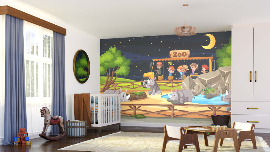 A nursery with a crib, rocking horse, and toys features the Zoo Night Safari Wall Mural, displaying cartoon koalas, trees, rocks, a pool, zoo sign, crescent moon, and stars in a vibrant nighttime zoo scene for kids and adults.