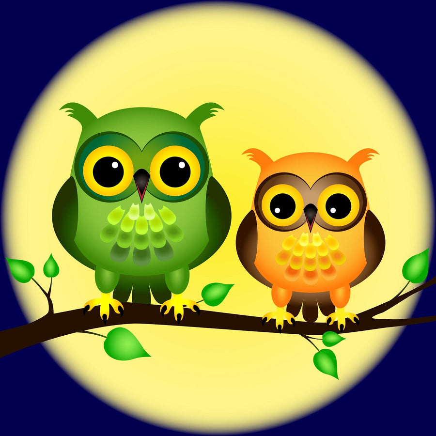 A nursery with a white crib, wicker ottoman, round mirror, and sheer-curtained windows showcases the Owls and Full Moon Wall Mural, which depicts two cartoon owls perched on a branch in front of a glowing moon.