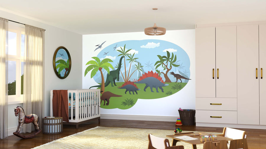 A bright nursery with a crib, toys, and rocking horse features the Peaceful Jurassic Land Wall Mural with dinosaurs, palm trees, and blue sky. Natural light streams in from a window with sheer curtains on the left.