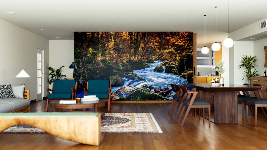 A modern open-concept living and dining room with wood floors, blue chairs, and a bright feel features contemporary wood furniture, pendant lights, and a Picturesque Mountain Stream Wall Mural as the focal point.