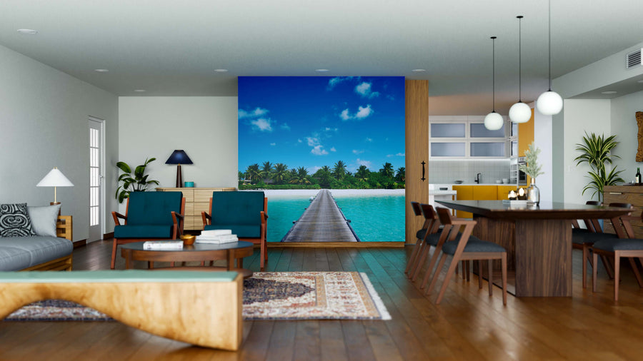 Modern open-plan living and dining area with wood floors, mid-century furniture, and the Beautiful Beach with Jetty Wall Mural, showcasing a tropical boardwalk over turquoise water for a vibrant, serene touch in this bright, stylish interior.