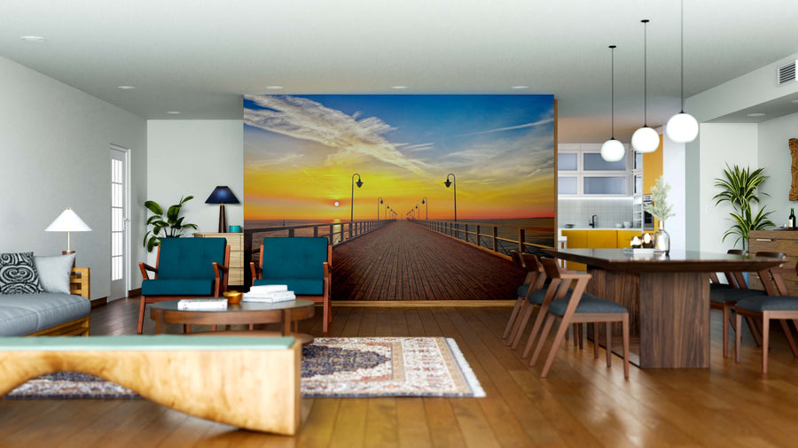Modern open living-dining area with wooden floors and stylish furniture, featuring the "Pier in Gdynia Wall Mural." Pendant lights, rugs, decorative accents, and removable wallpaper create a vibrant, versatile space.