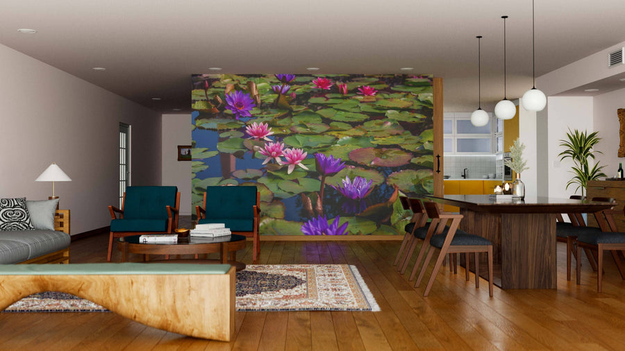 A modern living and dining room features wood floors, green chairs, a wooden table, and the Pink Lotus Blossoms Wall Mural in vibrant pinks and purples, creating a natural, artistic focal point in the contemporary space.
