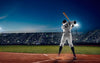Bring the thrill of the game to your space with the Ready to Swing Wall Mural, capturing a player ready to bat under bright stadium lights—perfect for sports fans seeking dynamic, canvas-textured wall art.