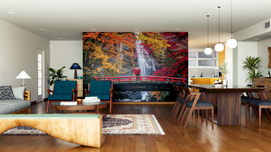 Bright, open living-dining area with wood floors and stylish furniture features the Red Bridge in Minoh Waterfall Wall Mural as a vibrant centerpiece, adding color and charm to the spacious interior.