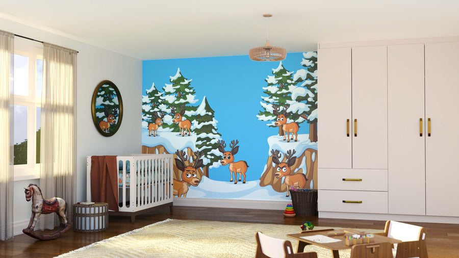 A bright nursery features a crib and the Reindeer Ridge Wall Mural with cartoon deer and snowy trees, plus a window with curtains, rocking horse, woven basket, wardrobe, and rug. Wooden floors and soft neutrals create a playful, cozy space.
