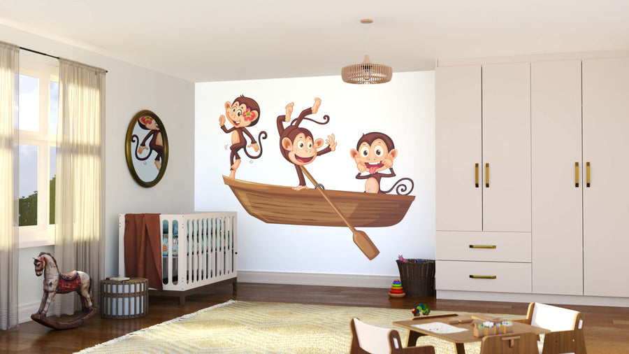 A bright, modern nursery is decorated with the Rowboat Monkeys Wall Mural and includes a crib, wardrobe, circular mirror, rocking horse, basket, toys on the floor, and sunlight streaming through sheer curtains.