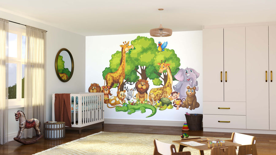 A bright nursery features the Safari Animal Party Wall Mural with lions, giraffes, zebras, and elephants under trees. The room includes a crib, rocking horse, toys, round mirror, light wood floors, and large windows with sheer curtains.
