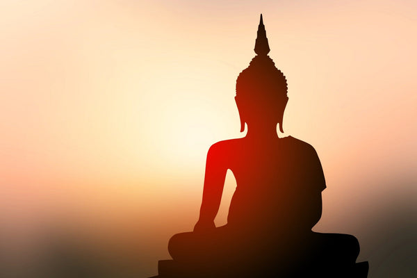 Silhouette of Buddha with Sun Shining from Behind