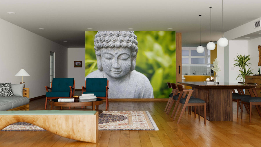 A modern living-dining area with wood floors and mid-century furniture features the Smiling Buddha Wall Mural—a serene focal point with a green leafy background. The open, bright space is enhanced by stylish lighting and decor.