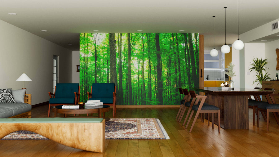 Modern open living-dining room with wood flooring, dark blue armchairs, dining table, globe pendant lights, and the Spring Forest Trees Wall Mural, adding a natural, vibrant touch to the contemporary decor.