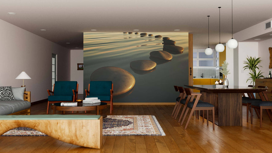 Modern open-concept living and dining area with wooden floors, teal armchairs, a dining table for six, and the Step Stones Sunset Wall Mural as a calming focal point. Spherical pendant lights hang above the table.