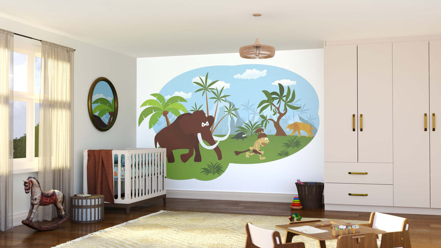 A bright nursery featuring the Stone Age Wall Mural with a mammoth, saber-toothed cat, cave kids, and lush plants. Sunlight fills the room, which includes a crib, toys, round mirror, plush rug, and storage cabinets.
