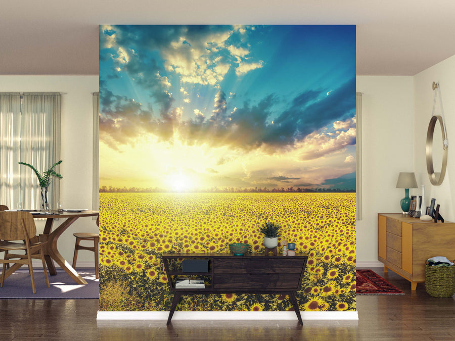 A bright living space showcases the Sunflowers at Dawn Wall Mural, depicting a vibrant sunflower field at sunrise. Contemporary furniture, lush plants, and a stylish dining area complete the cozy, modern atmosphere.