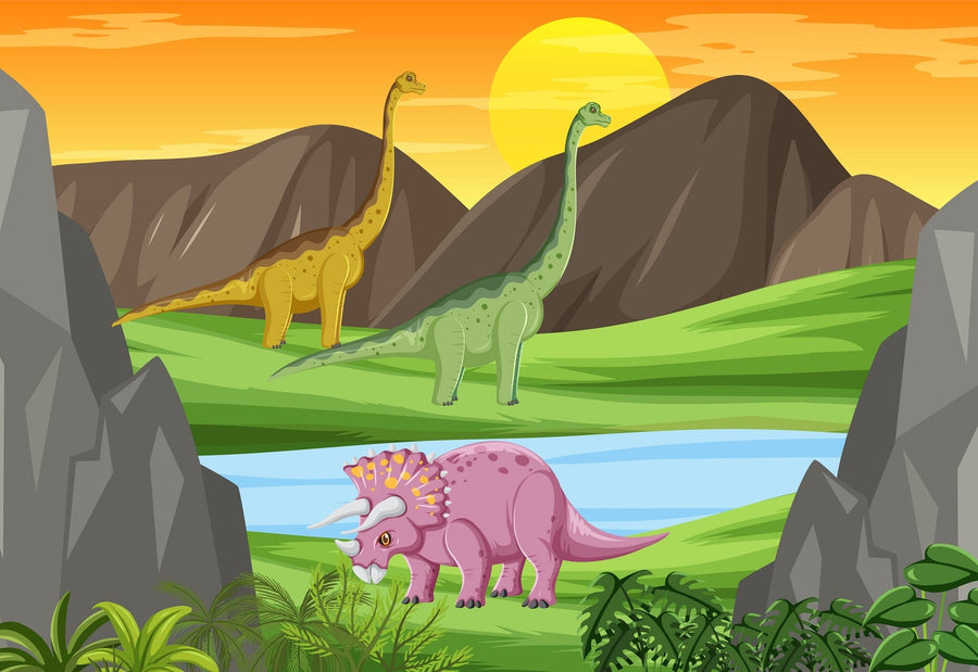 A nursery with a crib, white dresser, plants, toys, and shelves has its back wall decorated with the Sunset in Dino Valley Wall Mural—featuring mountains, a river, and three cartoon dinosaurs beneath a yellow-orange sunset sky.