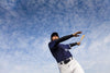 Bring dynamic energy to any space with the Baseball 10 Wall Mural, featuring a baseball player in a navy uniform and cap swinging a bat against a bright, cloud-filled sky. This commercial grade peel and stick mural is perfect for sports fans.