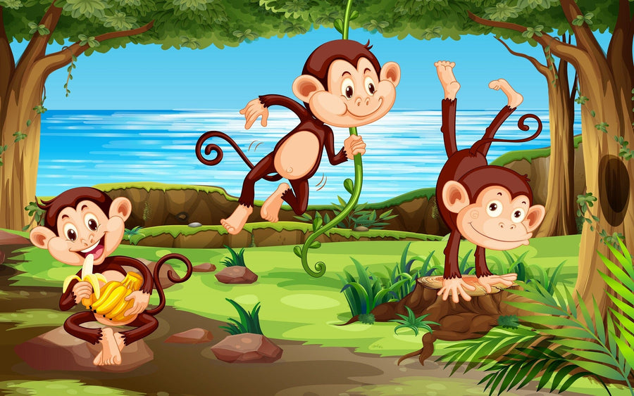 A bright nursery features the Swinging Monkeys Wall Mural with three cartoon monkeys in a jungle by water, along with a crib, rocking horse, basket, toys, white furniture, and sunlight through large windows with sheer curtains.