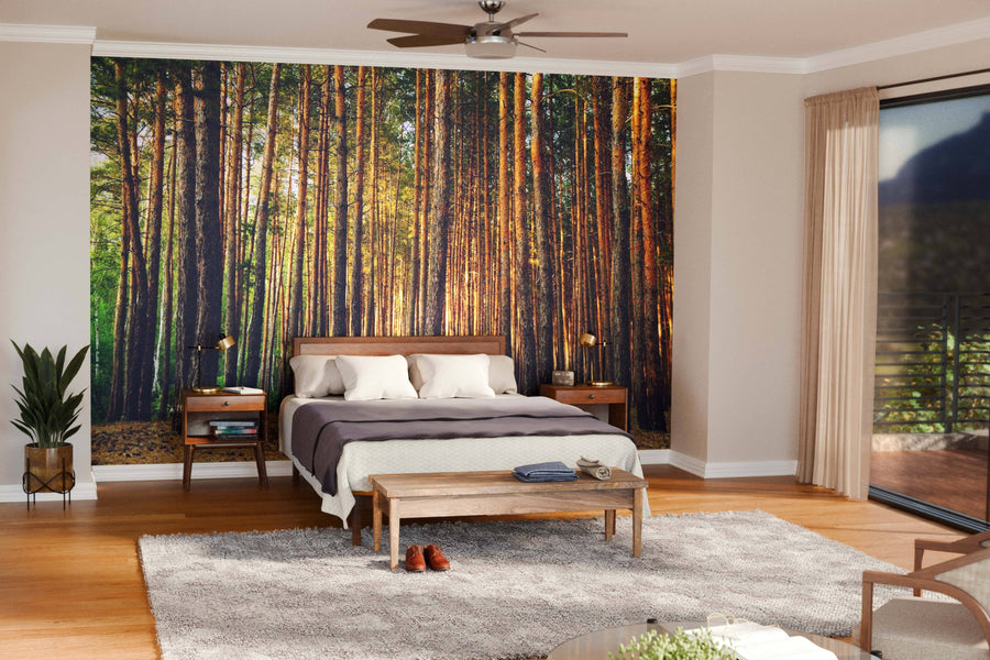 A modern open-plan living and dining area with wooden floors, mid-century furniture, and a large dining table is enhanced by the Tall Thin Forest Trees Wall Mural, bringing a serene, natural atmosphere to the stylish space.