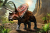 The Triceratops in Wild Wall Mural showcases a vivid illustration of a Triceratops on rocky, sunlit terrain with lush plants, cliffs, and a flying pterosaur beneath a bright sky—ideal for custom printed murals.