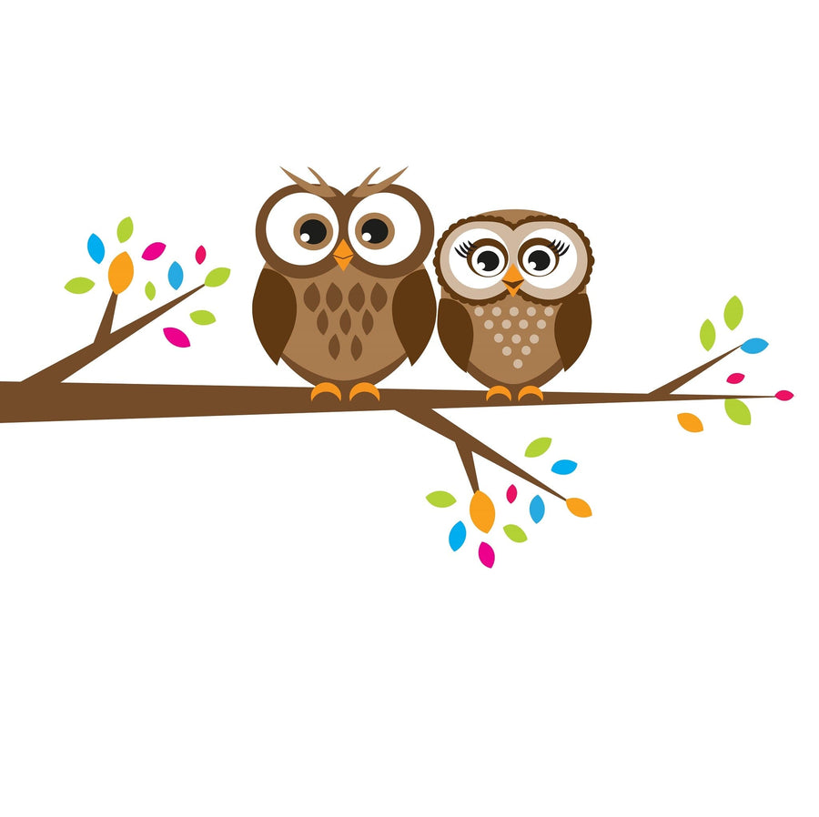 Modern nursery with a white crib, light gray walls, the Two Brown Owls Wall Mural featuring two cartoon owls on a leafy branch, white dresser, shelves with books and decor, a plant, and a gray rug on wooden floor.