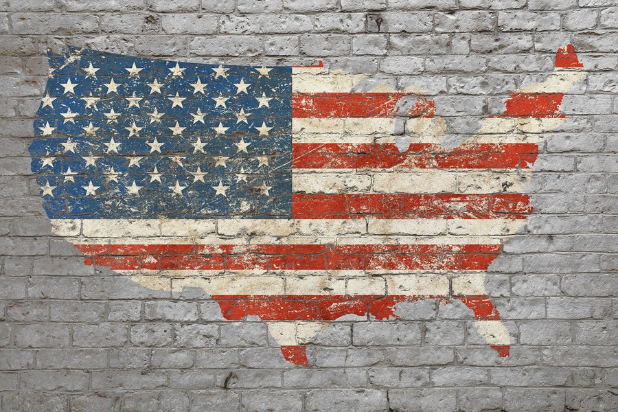 The USA Flag Brick Art Wall Mural features a weathered United States map with an American flag design on a gray brick wall, offering rustic style—perfect as custom printed mural or removable wallpaper for your space.