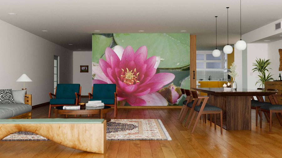 A modern open living-dining area with wood flooring showcases the Water Lily Wall Mural. Blue chairs, a gray sofa, and a wooden dining table sit under pendant lights, with the kitchen visible in the background.