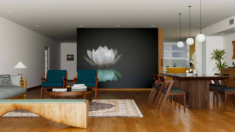 Modern open-plan living and dining area with wooden floors, teal chairs, a large Water Lily Reflection Wall Mural on a dark wall, round coffee table, rug, wooden dining set, pendant lights, and a yellow-accented kitchen in the background.