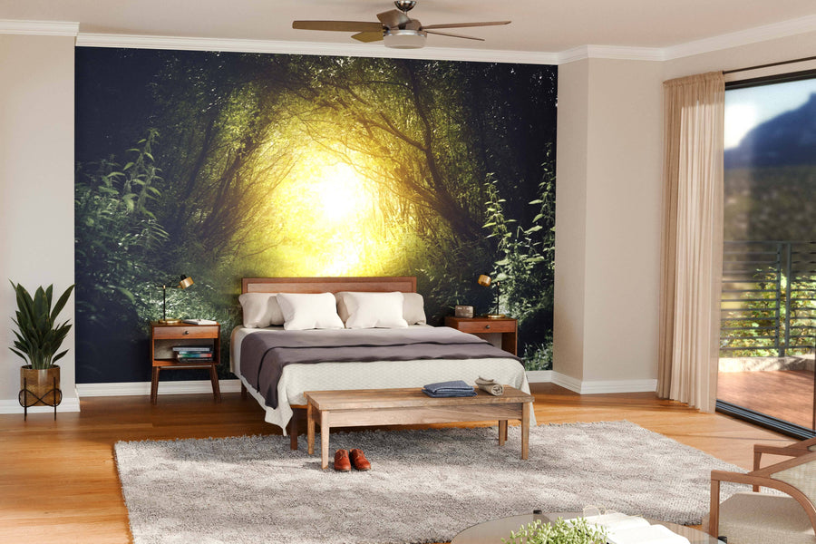 Modern open-concept living and dining room with wood floors, mid-century furniture, and the Way in Deep Forest Path Wall Mural for a serene vibe. Round lights hang above the dark dining table; kitchen sits in the background.