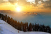 snowy mountain landscape at sunset, with trees silhouetted against the colorful sky – Peel and Stick Wall Murals