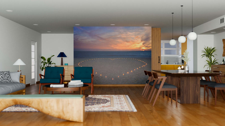 A modern living and dining area with wood floors and furniture features the Candles Heart Wall Mural, showcasing a sunset ocean scene with heart-shaped candles, bringing warmth and romance to the contemporary space.