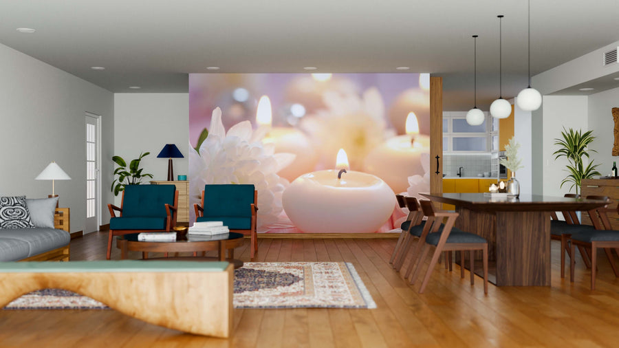 A modern open living and dining area with wooden floors, teal armchairs, a large Candles Wall Mural featuring glowing candles and white flowers, a long dining table, pendant lights, and contemporary-rustic decor.