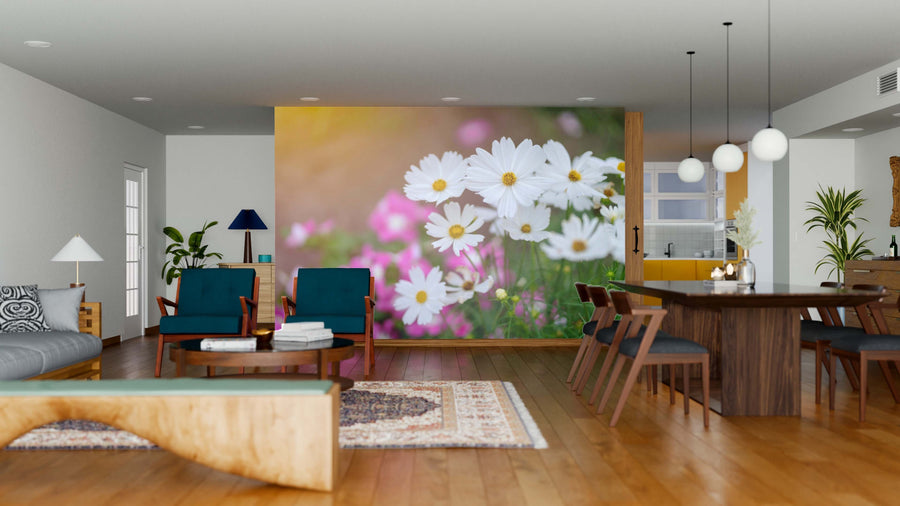 Modern open-plan living and dining area featuring wood floors, blue and wood furniture, plants, and the Flowers in the Garden Wall Mural—an easy-to-update removable wallpaper with vibrant white daisies and pink flowers for a fresh, nature-inspired look.
