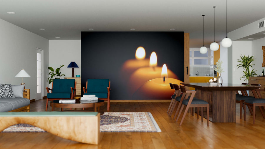 A modern living and dining area with wooden floors, teal chairs, a rug, plants, and the Wax Candles Wall Mural creates a warm, cozy vibe. Pendant lights hang above a wooden dining table with chairs.