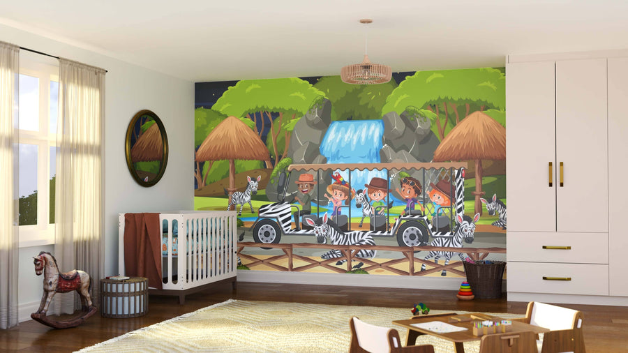 A cozy nursery features the Zebra Safari Ride Wall Mural with cartoon kids riding a zebra-striped jeep, zebras, a waterfall, huts, and trees. The room includes a crib, rocking horse, round mirror, baskets on wood floors, and a soft rug.