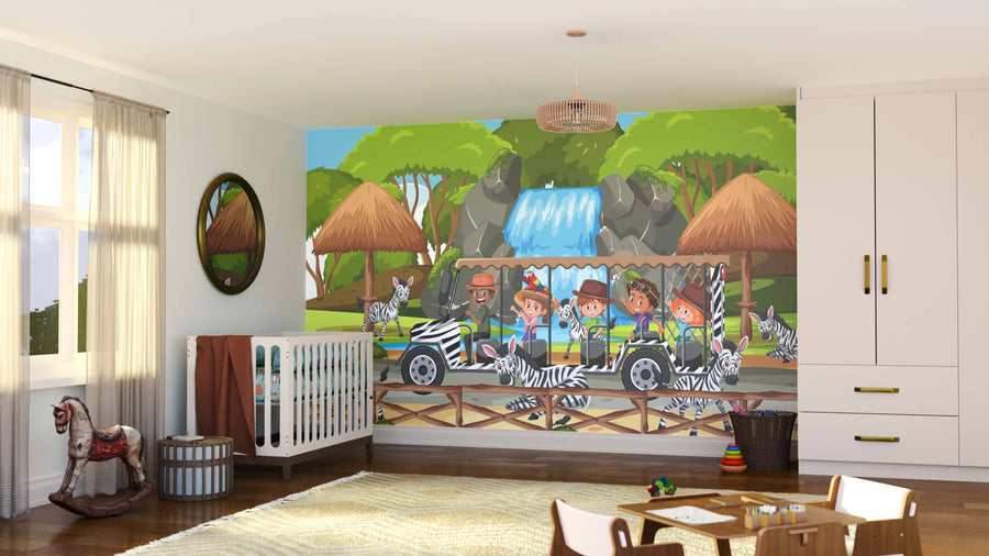 A children’s room displays the Zebra Zone Wall Mural, featuring kids in a jeep, zebras, huts, trees, and a waterfall. The space includes a crib, round mirror, storage basket, rocking horse, rug on wood floors, and large windows with natural light.