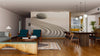 A modern open living-dining space features the Zen Garden Wall Mural with stone and raked sand. Teal armchairs, a wood coffee table, globe pendant lights, and a yellow kitchen complete the scene.